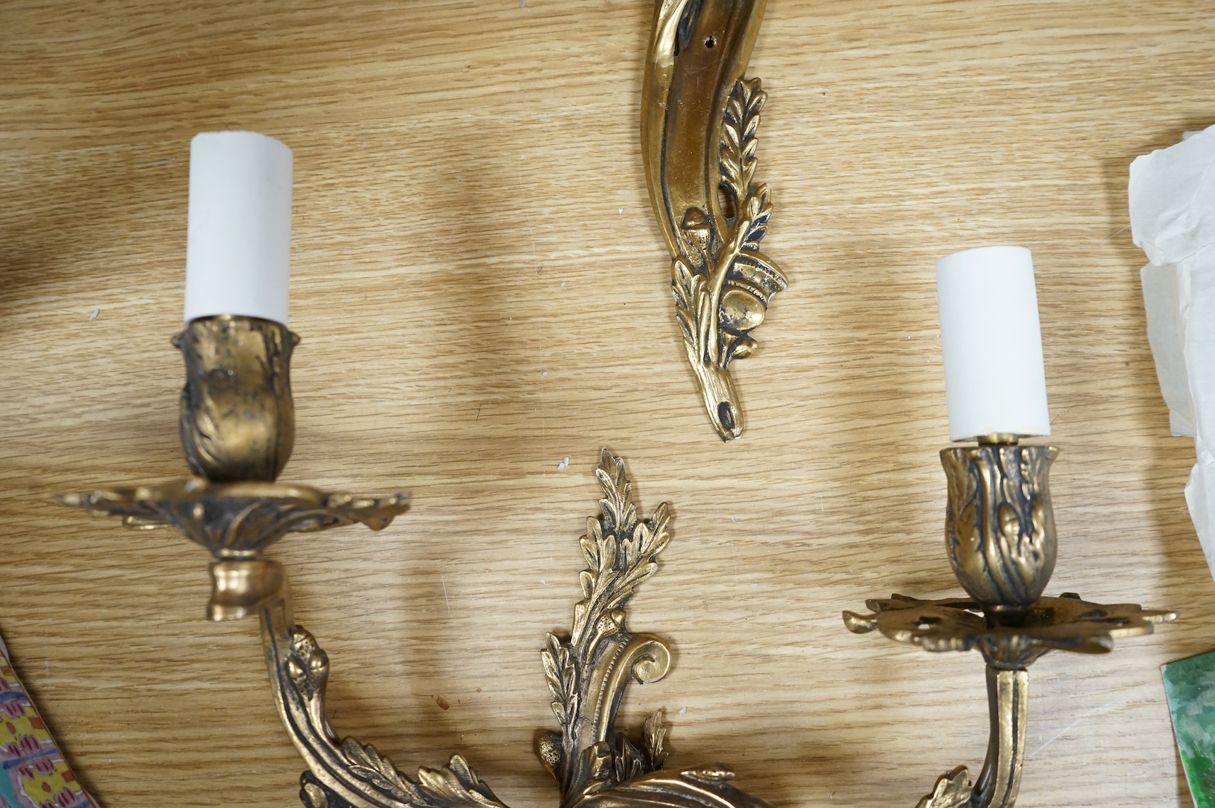 A pair of gilt metal two branch wall sconces, 37cm